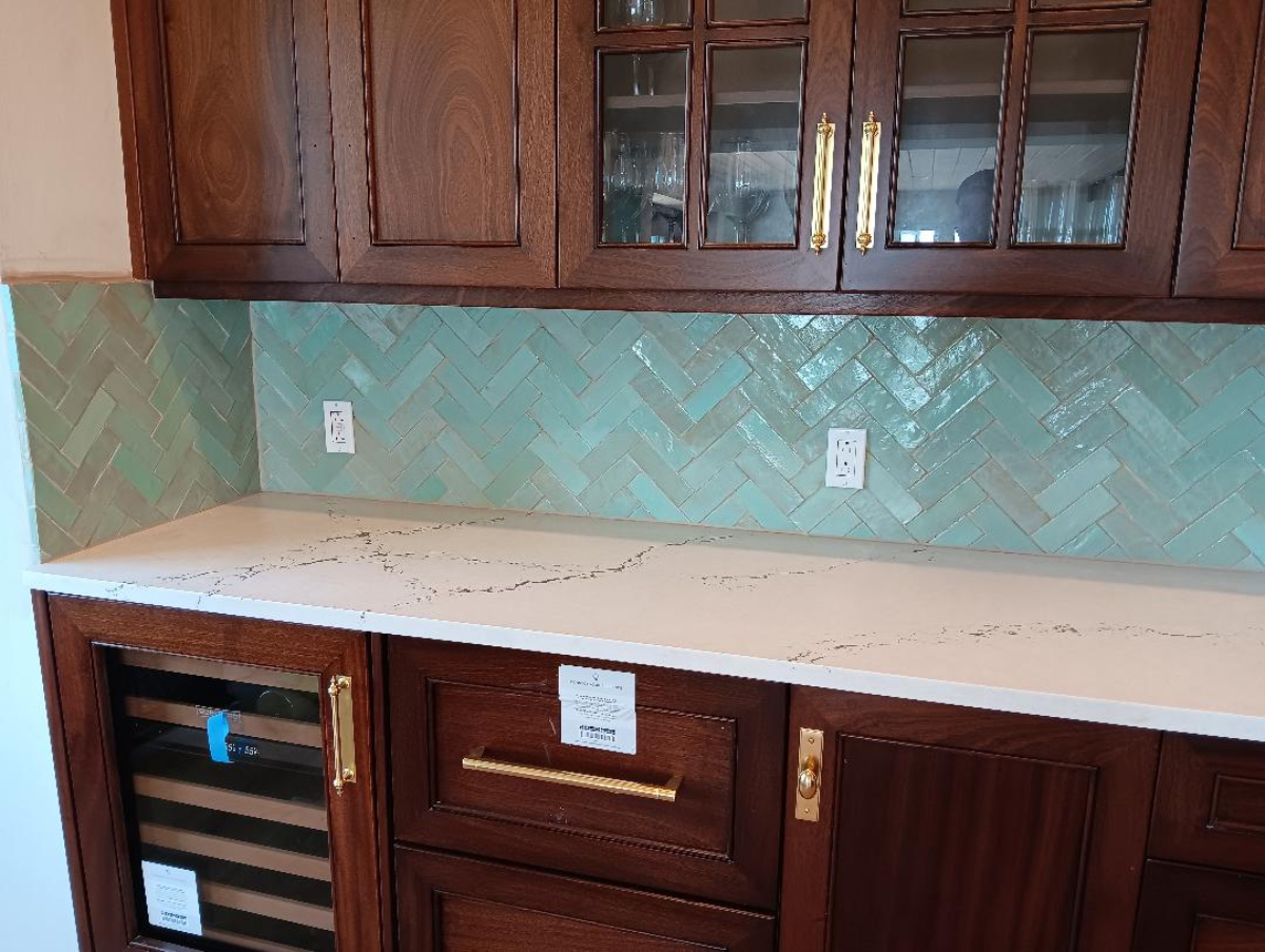 Tile backsplash with custom walnut cabinetry